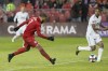 Toronto FC forward Jordan Hamilton (7) slots in his team's second goal against the New England Revolution during first half MLS soccer action in Toronto on Sunday, March 17, 2019. THE CANADIAN PRESS/Chris Young