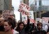 Protestors march near Toronto's financial district on Saturday October 15, 2011. A grassroots protest movement that began in the United States has crossed the border as Canadians across the country gathered to demonstrate against social inequality and corporate greed. THE CANADIAN PRESS/Chris Young