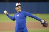 Toronto Blue Jays manager Charlie Montoyo tosses a ball during an on-field session in Toronto on Wednesday, March 27, 2019, ahead of tomorrow's season opening game. THE CANADIAN PRESS/Chris Young