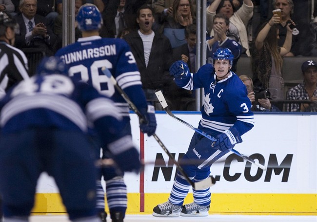 Toronto Maple Leafs captain Dion Phaneuf (right) turns to celebrate after scoring his team's second goal against Montreal Canadiens during third period NHL hockey action in Toronto on Thursday October 6, 2011.THE CANADIAN PRESS/Chris Young