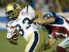 GRAHAM HUGHES / THE CANADIAN PRESS
Andre Sadeghian (33) is tackled by Montreal Alouettes' Chip Cox during second half action on Thursday.