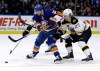 Boston Bruins' Dougie Hamilton, right, ties up New York Islanders' Thomas Vanek during the second period of the NHL hockey game, Monday, Jan. 27, 2014, in Uniondale, New York. Vanek is among the 10 players most likely to get dealt before Wednesday's NHL trade deadline. THE CANADIAN PRESS/AP/Seth Wenig