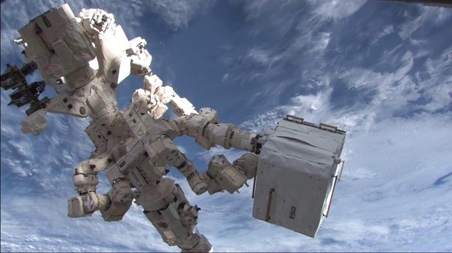 HO-NASA / The Canadian Press
Dextre, the Canadian Space Agency’s robotic handyman, ferries cargo from the Kounotori2 cargo ship to the International Space Station in February 2011. The Bank of Canada is set to unveil its latest plastic bank notes this week — but documents show some people found one of the new bills too cartoonish and the other too old-fashioned. Focus groups consulted about the proposed images for the new bank note series thought the space motif inclduding a depticion of Dextre of the new five-dollar bill looked childish.