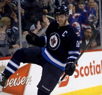 Winnipeg Jets' Andrew Ladd (16) celebrates after scoring against the Tampa Bay Lightning during second period NHL hockey action in Winnipeg, Tuesday, April 16, 2013. A realigned and highly competitive Central Division may cut travel time for the Winnipeg Jets, but it does little for their goal of making the playoffs.THE CANADIAN PRESS/Trevor Hagan