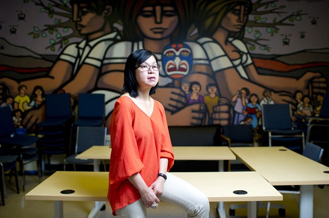 Manager of settlement programs, Khim Tan, poses for a photo in the community room at Mosaic, in Vancouver, B.C. on Monday, May 6, 2013. Mosaic is a non-profit resource centre for immigrants and refugees. THE CANADIAN PRESS/Jimmy Jeong