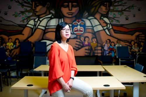 Manager of settlement programs, Khim Tan, poses for a photo in the community room at Mosaic, in Vancouver, B.C. on Monday, May 6, 2013. Mosaic is a non-profit resource centre for immigrants and refugees. THE CANADIAN PRESS/Jimmy Jeong