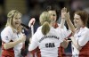 JONATHAN HAYWARD / THE CANADIAN PRESS
Team Canada skip Jennifer Jones (top left) soaks it in as teammates Jill Officer, Dawn Askin and Cathy Overton-Clapham exchange high fives following a profitable end against Quebec Saturday night. Team Canada went on to win the game 12-8.
