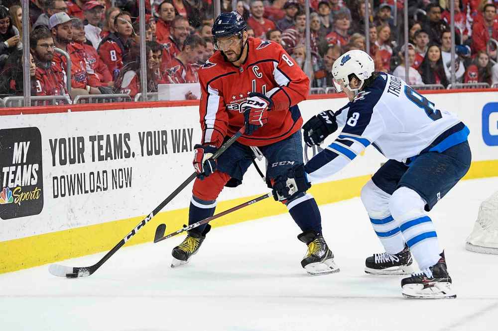 NICK WASS / THE ASSOCIATED PRESS
Washington Capitals left wing Alex Ovechkin, left, of Russia, skates with the puck against Winnipeg Jets defenseman Jacob Trouba, right, during the first period of an NHL hockey game, Sunday, March 10, 2019, in Washington.
