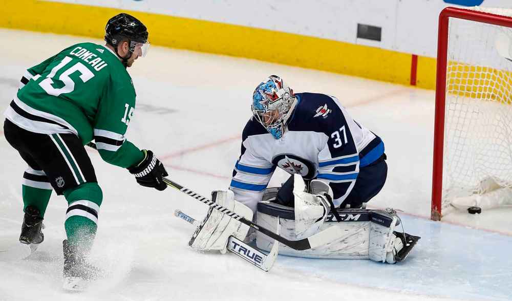 CP
LM OTERO / THE ASSOCIATED PRESS
Dallas Stars left wing Blake Comeau (15) scores a goal against Winnipeg Jets goaltender Connor Hellebuyck (37) during the second period of an NHL hockey game in Dallas, Saturday, Jan. 19, 2019.