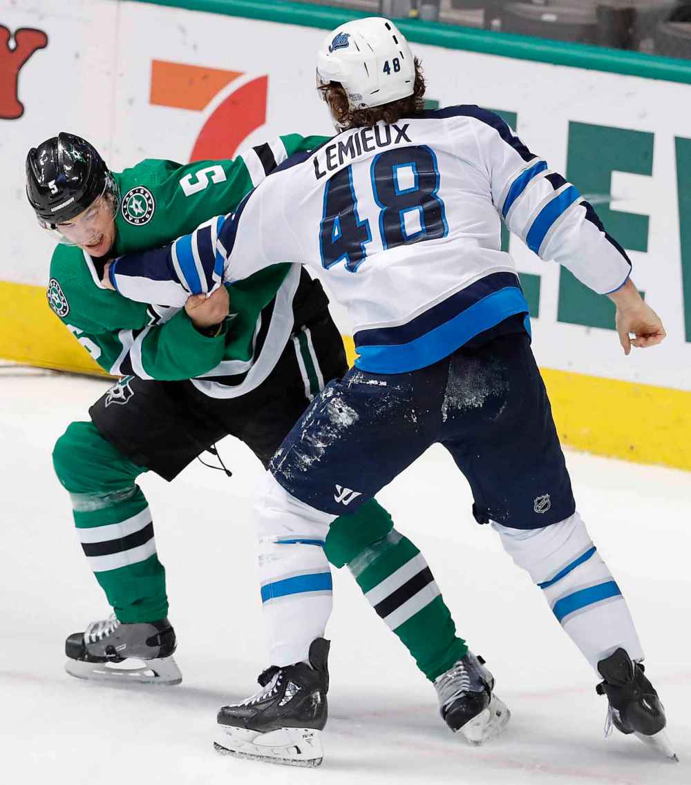 LM OTERO / THE ASSOCIATED PRESS
Winnipeg Jets left wing Brendan Lemieux (48) and Dallas Stars defenseman Connor Carrick (5) fight during the first period of an NHL hockey game in Dallas, Saturday, Jan. 19, 2019.