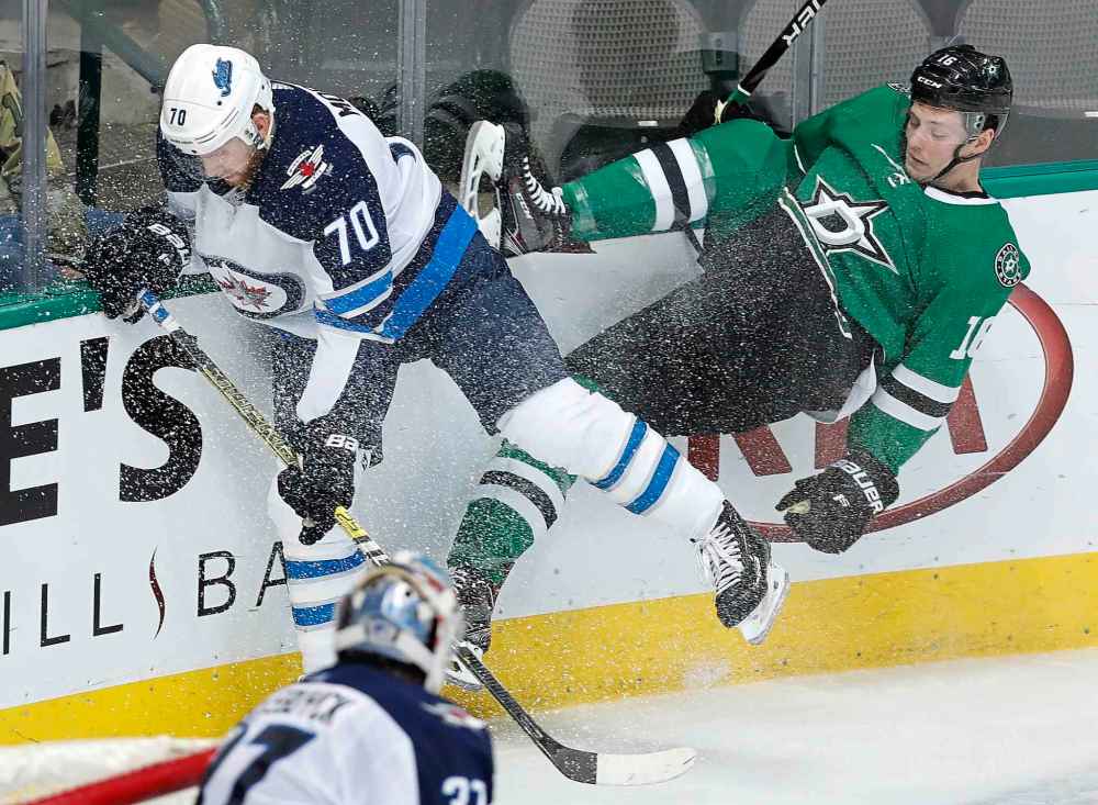 CP
LM OTERO / THE ASSOCIATED PRESS
Winnipeg Jets defenseman Joe Morrow (70) and Dallas Stars center Jason Dickinson (16) hit the boards while chasing the puck during the first period of an NHL hockey game in Dallas, Saturday, Jan. 19, 2019.