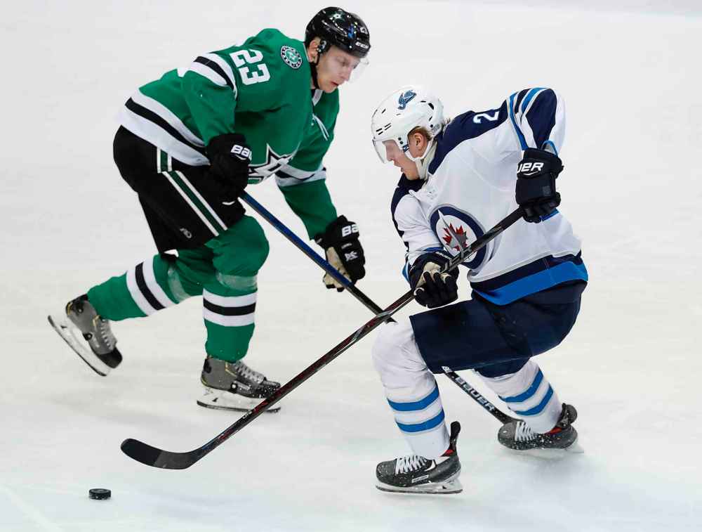 LM OTERO / THE ASSOCIATED PRESS
Winnipeg Jets right wing Patrik Laine (29) skates for the puck against Dallas Stars defenseman Esa Lindell (23) during the second period of an NHL hockey game in Dallas, Saturday, Jan. 19, 2019.