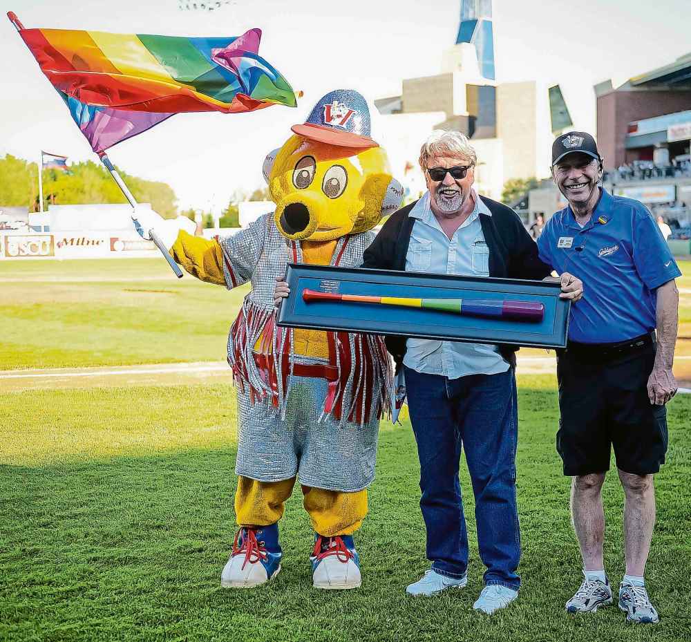 Presenting a bat to Gilbert Baker, creator of the Gay Pride flag, is a career highlight. (Supplied)