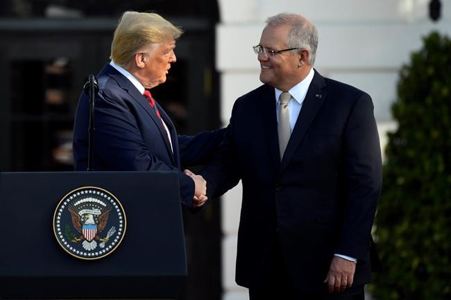 President Donald Trump shakes hands with Australian Prime Minister Scott Morrison during a State Arrival Ceremony on the South Lawn of the White House in Washington, Friday, Sept. 20, 2019. (AP Photo/Susan Walsh)