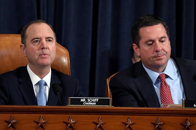 House Intelligence Committee Chairman Adam Schiff of Calif., left, speaks as Rep. Devin Nunes, R-Calif., the ranking member on the committee, listens during the House Intelligence Committee on Capitol Hill in Washington, Wednesday, Nov. 13, 2019, in the first public impeachment hearing of President Donald Trump's efforts to tie U.S. aid for Ukraine to investigations of his political opponents. (AP Photo/Susan Walsh)