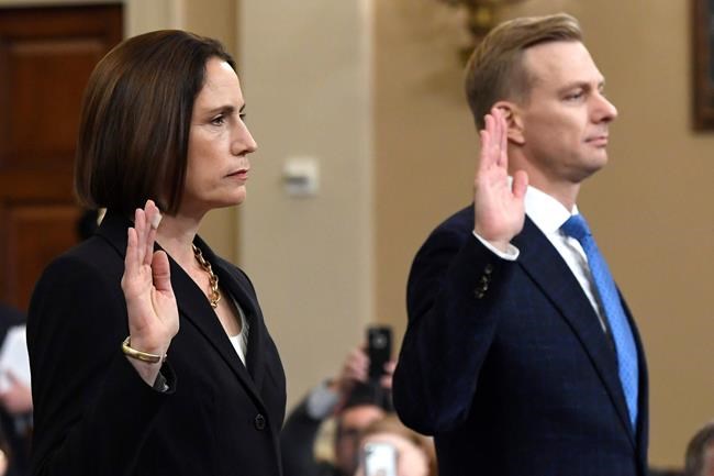 Former White House national security aide Fiona Hill, and David Holmes, a U.S. diplomat in Ukraine, are sworn in to testify before the House Intelligence Committee on Capitol Hill in Washington, Thursday, Nov. 21, 2019, during a public impeachment hearing of President Donald Trump's efforts to tie U.S. aid for Ukraine to investigations of his political opponents.(AP Photo/Susan Walsh)