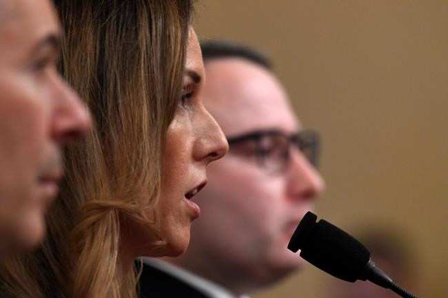 Jennifer Williams, an aide to Vice President Mike Pence, center, and National Security Council aide Lt. Col. Alexander Vindman, testify before the House Intelligence Committee on Capitol Hill in Washington, Tuesday, Nov. 19, 2019, during a public impeachment hearing of President Donald Trump's efforts to tie U.S. aid for Ukraine to investigations of his political opponents. (AP Photo/Susan Walsh)