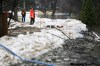 John Woods / The Canadian Press
City workers inspect a dike on Scotia Street.  Authorities put out another call for volunteers to help with flood efforts after Winnipeg and surrounding areas in the Red River valley were told Wednesday that this flood with be the second highest in the past 100 years.