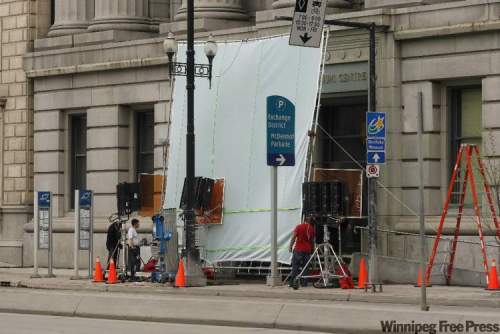 KEN GIGLIOTTI / WINNIPEG FREE PRESS
The Divide is shooting outside the Millennium Centre building on Main Street.