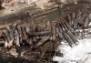 The downtown core of Lac-Mégantic lays in ruins as fire fighters continue to water smoldering rubble Sunday, July 7, 2013. THE CANADIAN PRESS/Ryan Remiorz