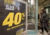 A woman enters a clothing store during 'Black Friday', in Montreal, November 23, 2012. THE CANADIAN PRESS/Graham Hughes