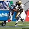 CNS Montreal Gazette
Special teams players Walter Spencer of the Montreal Alouettes and Derrick Doggett of the Winnipeg Blue Bombers jostle away from the play in first half action Sunday, September 20, 2009 at Percival Molson Stadium in Montreal.