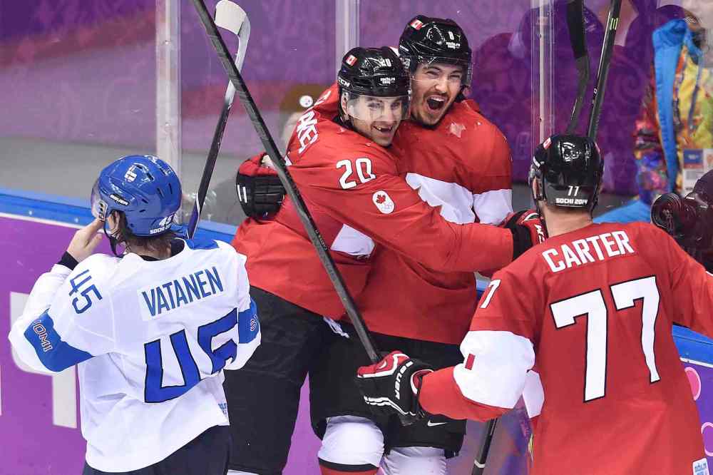 Nathan Denette / THE CANADIAN PRESS
Drew Doughty, centre, celebrates his OT winner with teammates John Tavares and Jeff Carter (right).