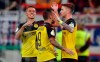 Dortmund's scorer Marco Reus, right, celebrates his opening goal with teammates Paco Alcacer and Thorgan Hazard during the German soccer cup, DFB Pokal, first Round match between KFC Uerdingen 05 and Borussia Dortmund in Duesseldorf, Germany, Friday, Aug.9, 2019. (AP Photo/Martin Meissner)