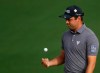 Corey Conners reacts after a putt on the second hole during the first round for the Masters golf tournament Thursday, April 11, 2019, in Augusta, Ga. (AP Photo/Chris Carlson)