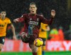 Liverpool's Virgil van Dijk kicks the ball during the English Premier League soccer match between Wolverhampton Wanderers and Liverpool at the Molineux Stadium in Wolverhampton, England, Friday, Dec. 21, 2018. The soccer broadcast landscape in Canada continues to change with the English Premier League shifting to DAZN next season.THE CANADIAN PRESS/AP/Rui Vieira