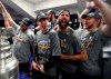 St. Louis Blues from left Brayden Schenn, Jordan Binnington, Joel Edmundson, Robert Bortuzzo and Vladimir Tarasenko, of Russia, right, celebrate with the Stanley Cup in the locker room after defeating the Boston Bruins in Game 7 of the NHL Stanley Cup Final, Wednesday, June 12, 2019, in Boston. (Dave Sandford/Pool via AP)