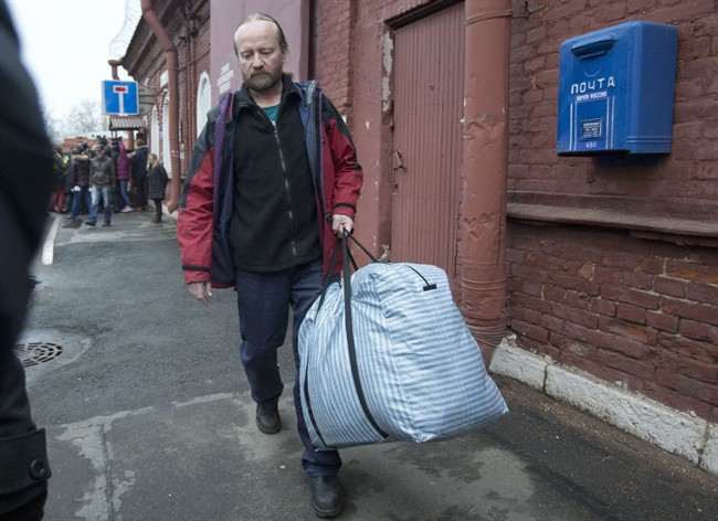 Canadian activist Paul Ruzycki walks after being released from a prison in St. Petersburg, Russia, Friday, Nov. 22, 2013. THE CANADIAN PRESS/AP, Pavel Golovkin