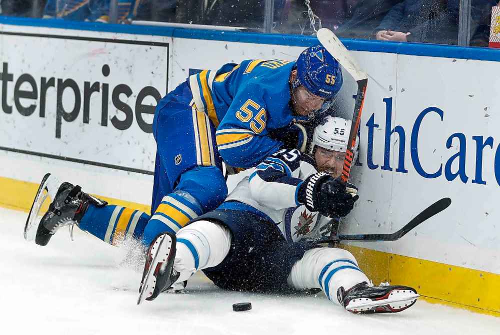JEFF ROBERSON / THE ASSOCIATED PRESS
Winnipeg Jets' Mark Scheifele, right, is checked by St. Louis Blues' Colton Parayko during the first period of an NHL hockey action.