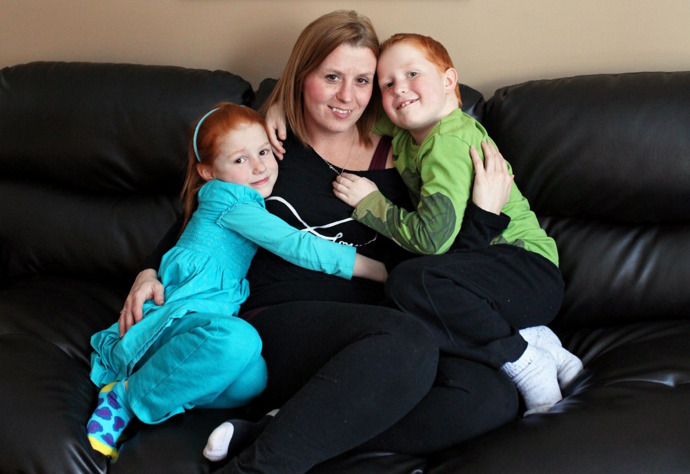 Tim Smith / Brandon Sun
Cheryl Mauthe with children Emily (left) and Colin.