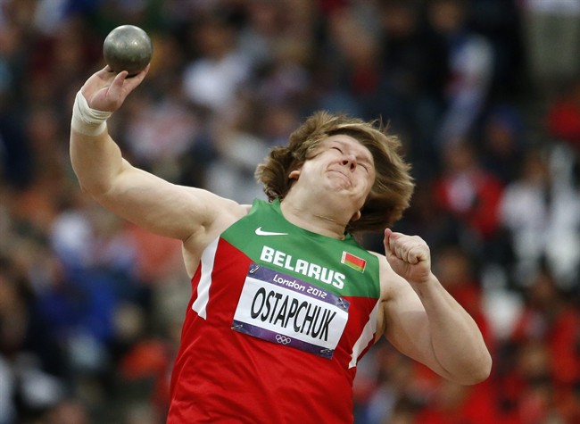 FILE - In this Monday, Aug. 6, 2012 file photo, Belarus' Nadzeya Ostapchuk takes a throw in the women's shot put final during the athletics in the Olympic Stadium at the 2012 Summer Olympics, London. Ostapchuk became the first athlete to be stripped of a medal at the London Olympics after her gold was withdrawn for doping. Valerie Adams of New Zealand will now take gold and Evgeniia Kolodko of Russia will get silver. Fourth-place finisher Gong Lijiao of China moves up to bronze. The International Olympic Committee said Monday Aug. 13, 2012 that Ostapchuk tested positive for the steroid metenolone. She won the shot put exactly a week earlier. The IOC says she was tested the day before her competition and again following the event. Both samples were positive. (AP Photo/Matt Dunham)