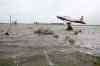 Tim Smith / Brandon Sun
Flood waters surround a T33 fighter jet on display along Highway 10 and Sandison Road near the Brandon Municipal Airport on Sunday.  Rain fell almost non-stop throughout the weekend, and the airport was closed due to the flooding.