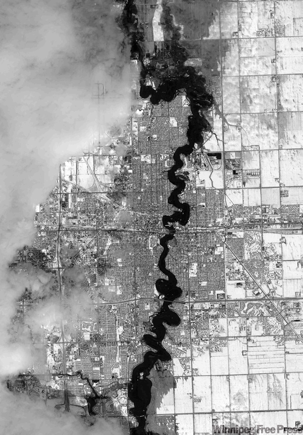 DigitalGlobe / The Associated Press
This black and white satellite image taken Sunday March 29 shows the Red River and areas of flooding in Fargo, N.D.