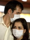Andre Penner / AP Photo
Passengers wearing masks arrive at the international airport in Sao Paulo today. A Brazilian hospital said a patient who arrived from Mexico has been hospitalized on Sunday with some symptoms of swine flu.