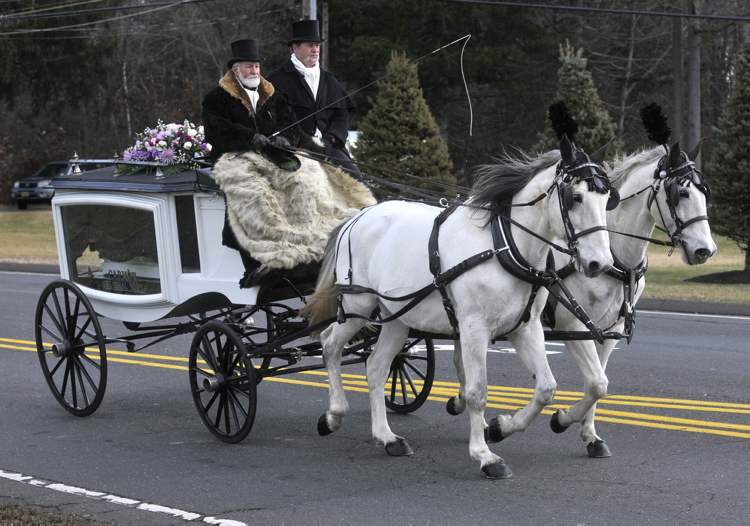 Brad Horrigan / Hartford Courant
A horse-drawn carriage carries Ana Grace Marquez-Greene's casket to the First Cathedral in Bloomfield, Conn., Saturday.