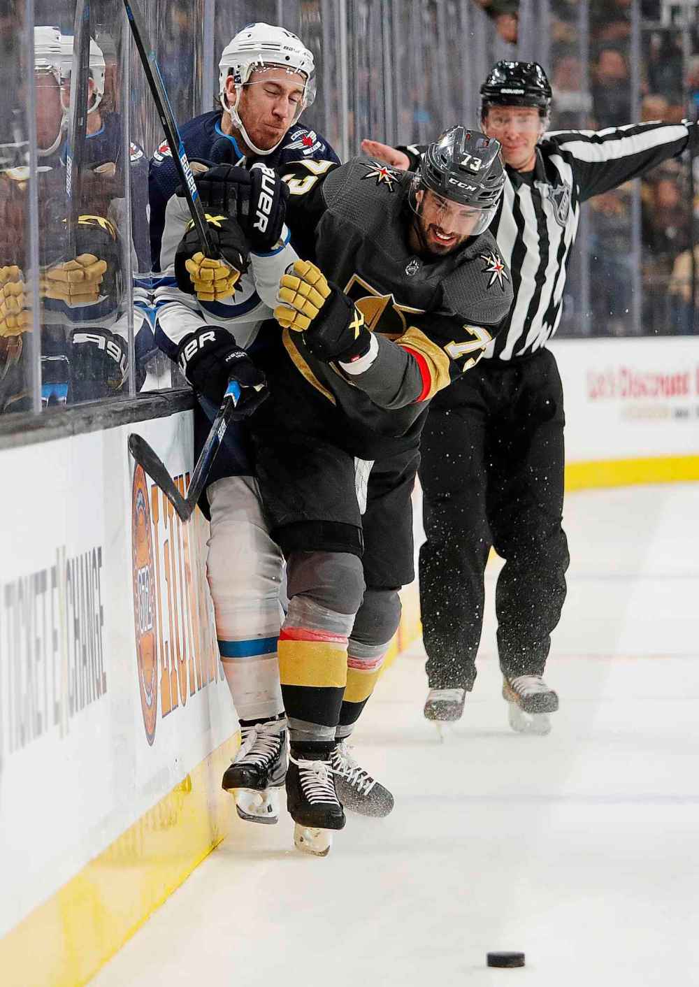 Vegas Golden Knights center Brandon Pirri (73) checks Winnipeg Jets right wing Kevin Hayes into the boards during the first period of an NHL hockey game Thursday, March 21, 2019, in Las Vegas. John Locher / The Associated Press files