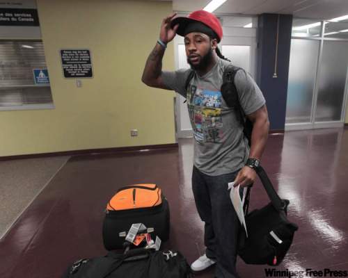 JOE.BRYKSA@FREEPRESS.MB.CA
Jonathan Hefney arrives at the Richardson International airport Tuesday afternoon after getting cut by the Detroit Lions. After clearing medicals today he is expected to join the Winnipeg Blue Bombers practice and travel with the team to B.C.