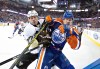 JASON FRANSON / The Canadian Press
Pittsburgh Penguins' Craig Adams checks Edmonton Oilers' Matt Fraser during NHL hockey action in Edmonton in the 2014-15 season.