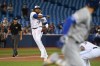 Toronto Blue Jays' Vladimir Guerrero Jr. throws to first base to put out Kansas City Royals' Alex Gordon during the first inning of AL baseball game action on Friday June 28, 2019 in Toronto. THE CANADIAN PRESS/Jon Blacker