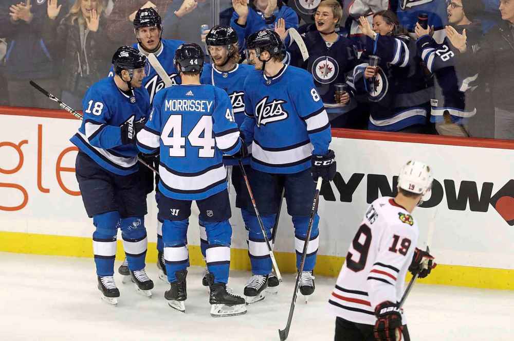 THE CANADIAN PRESS/Trevor Hagan
Winnipeg Jets' Bryan Little (18), Patrik Laine (29), Josh Morrissey (44), Kyle Connor (81) and Jacob Trouba (8) celebrate after Connor scored as Chicago Blackhawks' Jonathan Toews (19) looks on during first period NHL hockey action in Winnipeg, Tuesday.
