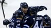 Trevor Hagan / Winnipeg Free Press archives
Winnipeg Jets' Blake Wheeler (top) celebrates with Grant Clitsome (left) and Zach Bogosian after he assisted on Bogosian's goal during the first period.Wheeler re-signed with the Jets Friday; Bogosian did the same Monday.