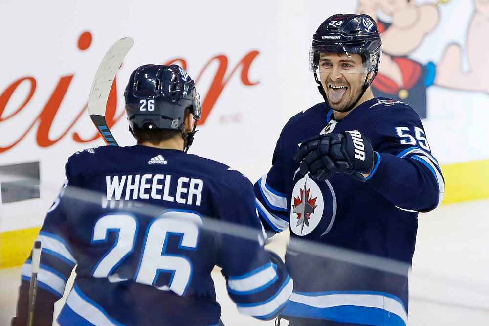 John Woods / Winnipeg Free Press
Winnipeg Jets' Blake Wheeler (26) and Mark Scheifele (55) are ready for a packed schedule.