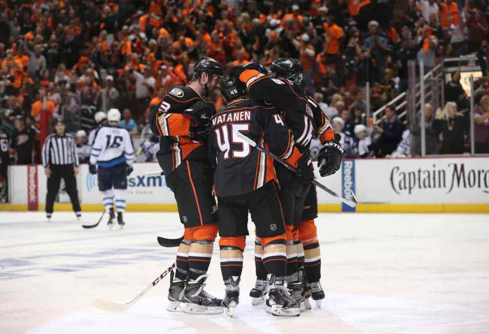 Robert Gauthier / Tribune Media TNS
The Anaheim Ducks' Sami Vatanen (45) is lauded by teammates after scoring early in the first period against the Winnipeg Jets during Game 1. The Ducks claimed victory after a reviewed third-period goal by Corey Perry, winning the game 4-2.