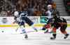 Jae C. Hong / The Associated Press
Winnipeg Jets' Blake Wheeler, left, passes the puck under pressure by Anaheim Ducks' Rickard Rakell during the first period.