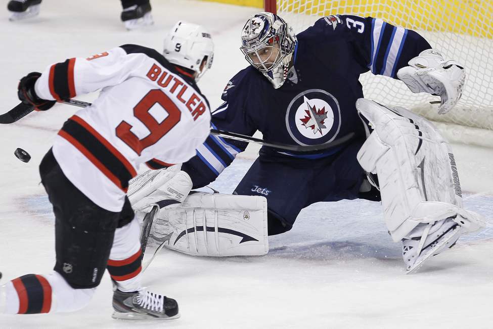 John Woods / The Canadian Press
Winnipeg Jets goaltender Ondrej Pavelec saves the shot from New Jersey Devils' Bobby Butler during the first-period.