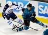 Marcio Jose Sanchez / The Associated Press
San Jose Sharks defenceman Jason Demers (right) battles Winnipeg Jets left-winger Adam Lowry during second-period action Saturday night.